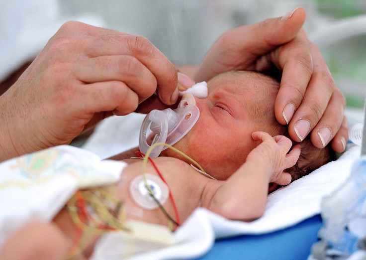 What causes intraventricular hemorrhage in premature infants?